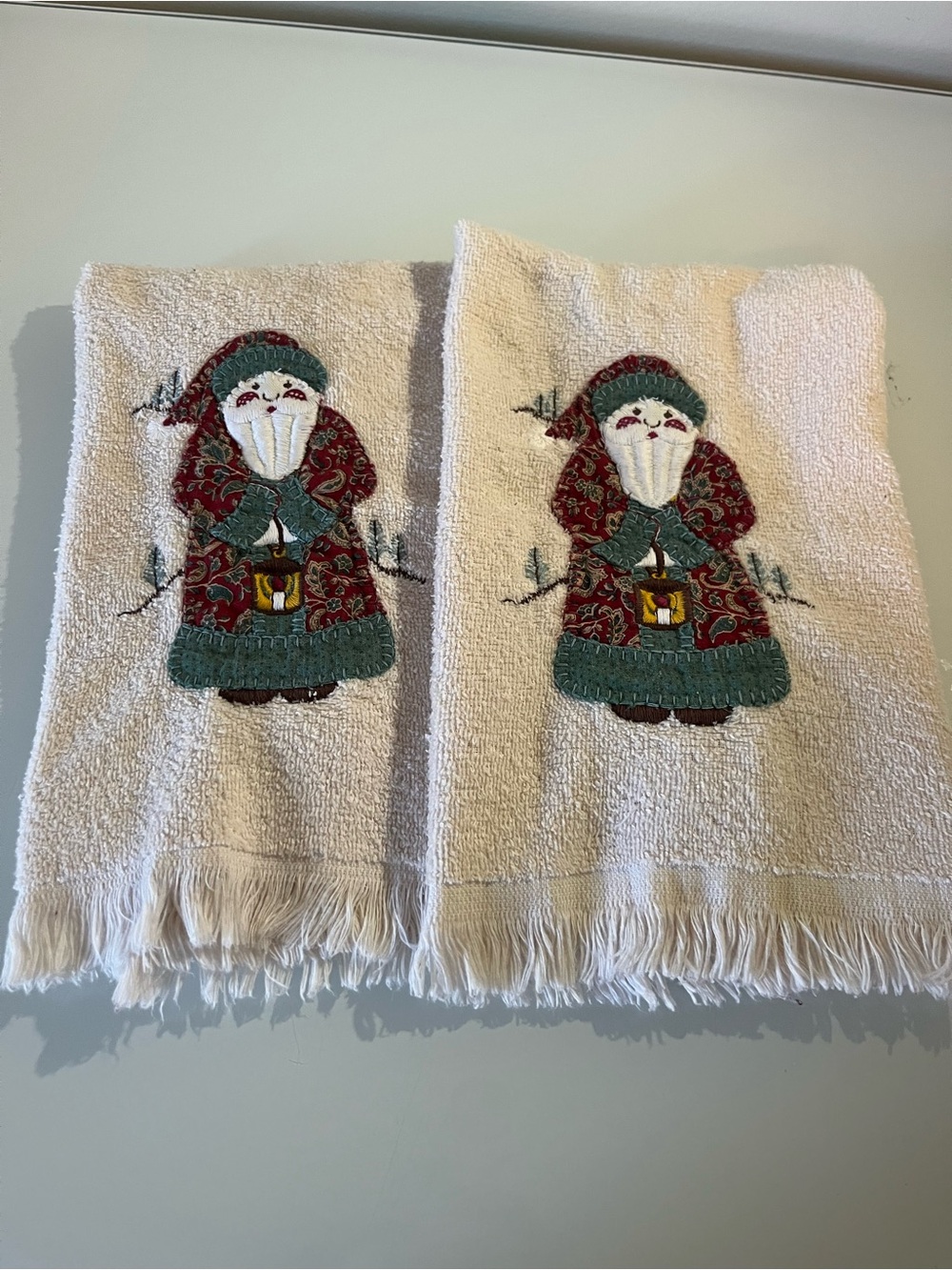 Canon 2pc set Cream Fringed Hand Towels with Red and Green Santa Appliqués